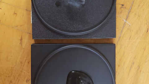 Ice melting on two black blocks made from different materials