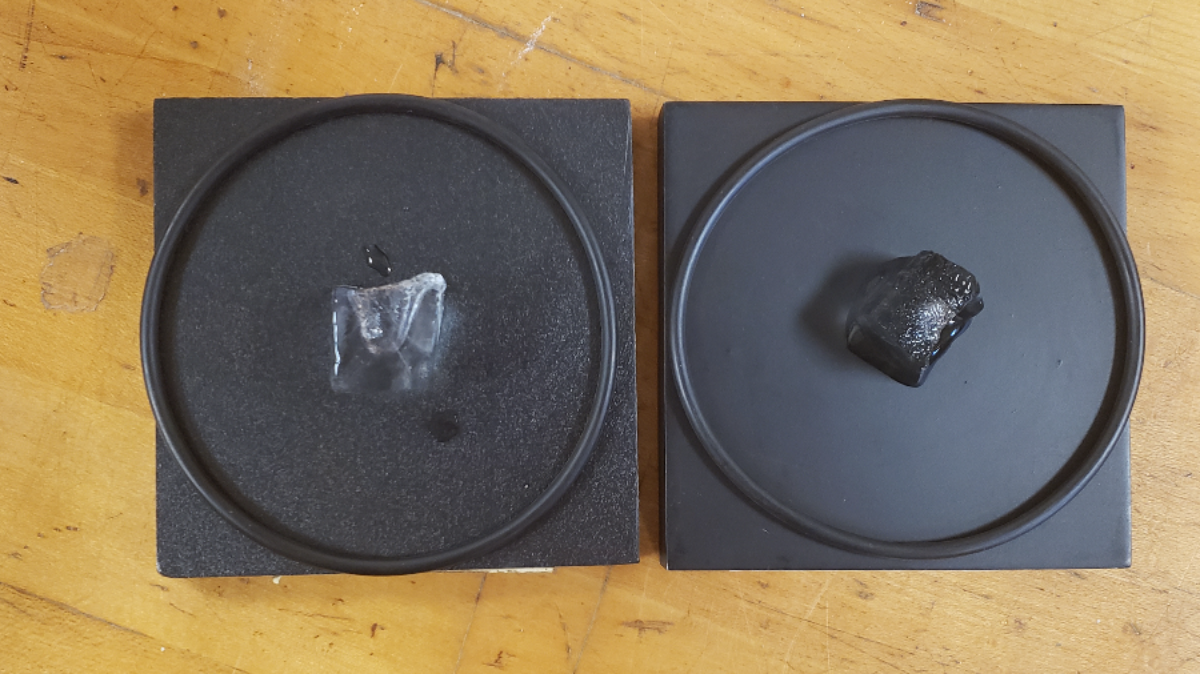 Ice melting on two black blocks made from different materials